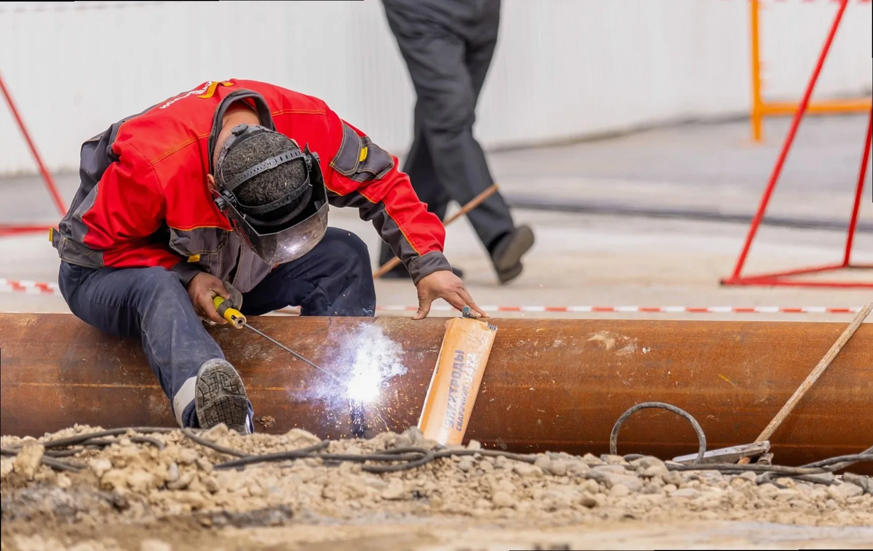 Industrial welding sparks and steel fabrication in a workshop
